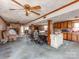 Spacious living room featuring a ceiling fan, wood paneling, and an open floor plan at 265 Sailboat Dr, Salisbury, NC 28146