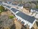 A drone shot showcases the townhome's back decks and yard space relative to others in the community at 2656 Grantham Place Dr, Fort Mill, SC 29715