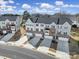 A drone shot highlights the townhouse's garages, driveways, and varied front exterior at 2656 Grantham Place Dr, Fort Mill, SC 29715