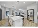Open concept kitchen featuring an island with bar seating and stylish black hardware at 2656 Grantham Place Dr, Fort Mill, SC 29715