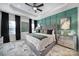 Serene main bedroom featuring tray ceiling, decorative accent wall, and neutral décor at 2656 Grantham Place Dr, Fort Mill, SC 29715