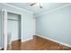 This bedroom offers ample closet space, wood floors and a ceiling fan at 2687 Glenn St, Newton, NC 28658