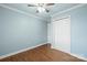 This cozy bedroom features light blue walls, white trim, and a ceiling fan for added comfort at 2687 Glenn St, Newton, NC 28658