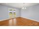 Dining room featuring hardwood floors, chandelier, and French doors to the exterior at 2687 Glenn St, Newton, NC 28658