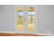 View through the French doors leading to a wooden deck at 2687 Glenn St, Newton, NC 28658