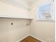 Convenient laundry room with shelving and a window allowing for ample light at 2687 Glenn St, Newton, NC 28658