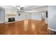 Open living room showcasing a fireplace, hardwood floors, recessed lighting, and a breakfast bar to the kitchen at 2687 Glenn St, Newton, NC 28658