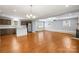 Open concept living room with a bright color palette, stylish floors and a brick fireplace at 2687 Glenn St, Newton, NC 28658