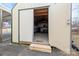 Interior of outdoor shed featuring concrete flooring and wooden shelving for storage at 2687 Glenn St, Newton, NC 28658