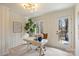 Bright office space featuring white wainscoting, a modern desk, and access to a deck at 2827 Temple Ln, Charlotte, NC 28205