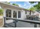 Backyard deck provides an excellent outdoor seating area right off the glass-enclosed sunroom at 3231 Eastwood Dr, Charlotte, NC 28205
