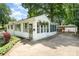 Charming single-story home featuring a covered carport, landscaped yard, and inviting curb appeal at 3231 Eastwood Dr, Charlotte, NC 28205