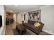 Comfortable living room with a large decorative world map, modern coffee table, and stylish patterned rug at 3231 Eastwood Dr, Charlotte, NC 28205