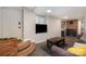 Inviting living room with brick steps, a modern TV, sleek flooring, comfortable seating, and stylish decor at 3231 Eastwood Dr, Charlotte, NC 28205