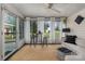 Inviting sunroom with lots of natural light, comfortable seating, and neutral decor at 3231 Eastwood Dr, Charlotte, NC 28205