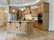 Spacious kitchen with granite countertops, stainless steel appliances, and ample cabinet space at 333 Lifestyle Ct, Cramerton, NC 28056
