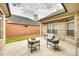 Brick back patio with outdoor seating under a covered area, perfect for relaxation at 333 Lifestyle Ct, Gastonia, NC 28056