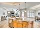 Open-concept kitchen features stainless steel appliances and granite countertops with an island at 333 Lifestyle Ct, Cramerton, NC 28056