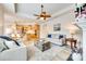 Open-concept living area with a fireplace and view of the kitchen and breakfast bar at 333 Lifestyle Ct, Cramerton, NC 28056