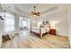 Spacious main bedroom featuring trey ceilings, ceiling fan and sitting area at 333 Lifestyle Ct, Cramerton, NC 28056