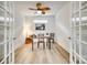 Bright office space with wood floors, modern desk, and a decorative ceiling fan at 333 Lifestyle Ct, Cramerton, NC 28056