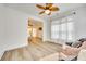 Bright sitting room featuring large windows and view into the main bedroom at 333 Lifestyle Ct, Cramerton, NC 28056