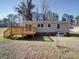 The home's backyard features a wooden deck, siding, and a spacious yard at 3410 Nc 109 N Hwy, Wadesboro, NC 28170