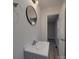 This bathroom features a sink, mirror, window, and modern lighting at 3410 Nc 109 N Hwy, Wadesboro, NC 28170