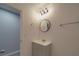 Bathroom featuring a gray vanity, modern lighting, and gray wood-look flooring at 3410 Nc 109 N Hwy, Wadesboro, NC 28170