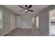 Bedroom features gray walls, wood-look flooring, and a fan at 3410 Nc 109 N Hwy, Wadesboro, NC 28170