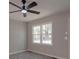 Bedroom featuring a modern ceiling fan, double window, and light gray walls at 3410 Nc 109 N Hwy, Wadesboro, NC 28170