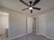 This bedroom has gray walls, wood-look floors, a ceiling fan, and several doors at 3410 Nc 109 N Hwy, Wadesboro, NC 28170