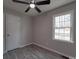 Bedroom featuring a window, ceiling fan, and a closet at 3410 Nc 109 N Hwy, Wadesboro, NC 28170