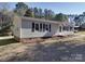 Charming single-story home featuring black shutters, well-maintained yard, and inviting front entrance at 3410 Nc 109 N Hwy, Wadesboro, NC 28170
