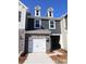 Charming two-story home with stone accents and a one-car garage on a sunny day at 3427 Secrest Lndg, Monroe, NC 28110