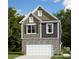 Charming two-story home features a blend of textures, including brick, siding and an attached two-car garage at 3532 Nimbell Rd, Monroe, NC 28110