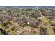 Aerial view of a neighborhood with a house in the center of the image indicated by a large white arrow at 3598 Puett Park Dr, Conover, NC 28613