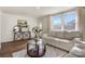 Bright living room with modern decor, featuring a comfortable sofa and ample natural light at 3598 Puett Park Dr, Conover, NC 28613