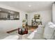 Cozy living room with view into the kitchen, featuring a sofa and stylish decor at 3598 Puett Park Dr, Conover, NC 28613