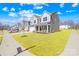 Gorgeous two-story home featuring a well-manicured lawn and an attached two-car garage at 4021 Eckels Dr, Charlotte, NC 28215
