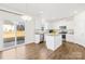 Modern kitchen with white cabinets, stainless appliances, and center island at 4021 Eckels Dr, Charlotte, NC 28215