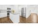 Modern kitchen with white cabinets, stainless appliances, and island at 4021 Eckels Dr, Charlotte, NC 28215