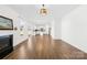 Bright living room with fireplace and view to the kitchen at 4021 Eckels Dr, Charlotte, NC 28215