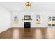 Bright living room with fireplace and wood floors at 4021 Eckels Dr, Charlotte, NC 28215