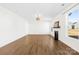 Large bright living room with wood flooring, white walls, a fireplace and large windows at 4021 Eckels Dr, Charlotte, NC 28215