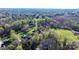 Expansive aerial shot of elegant homes nestled among mature trees in a serene setting at 4025 4Th Street Nw Ln, Hickory, NC 28601