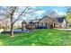 Lush backyard featuring a well-maintained lawn, pool, and home with a covered patio at 4025 4Th Street Nw Ln, Hickory, NC 28601