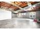 Large unfinished basement with exposed ceiling and cinder block walls, offering potential for customization at 4025 4Th Street Nw Ln, Hickory, NC 28601
