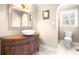 Elegant bathroom with a carved vanity and tiled floors, exuding classic charm at 4025 4Th Street Nw Ln, Hickory, NC 28601