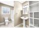 Classic bathroom featuring a pedestal sink, toilet, shower, and a mirrored medicine cabinet at 4025 4Th Street Nw Ln, Hickory, NC 28601